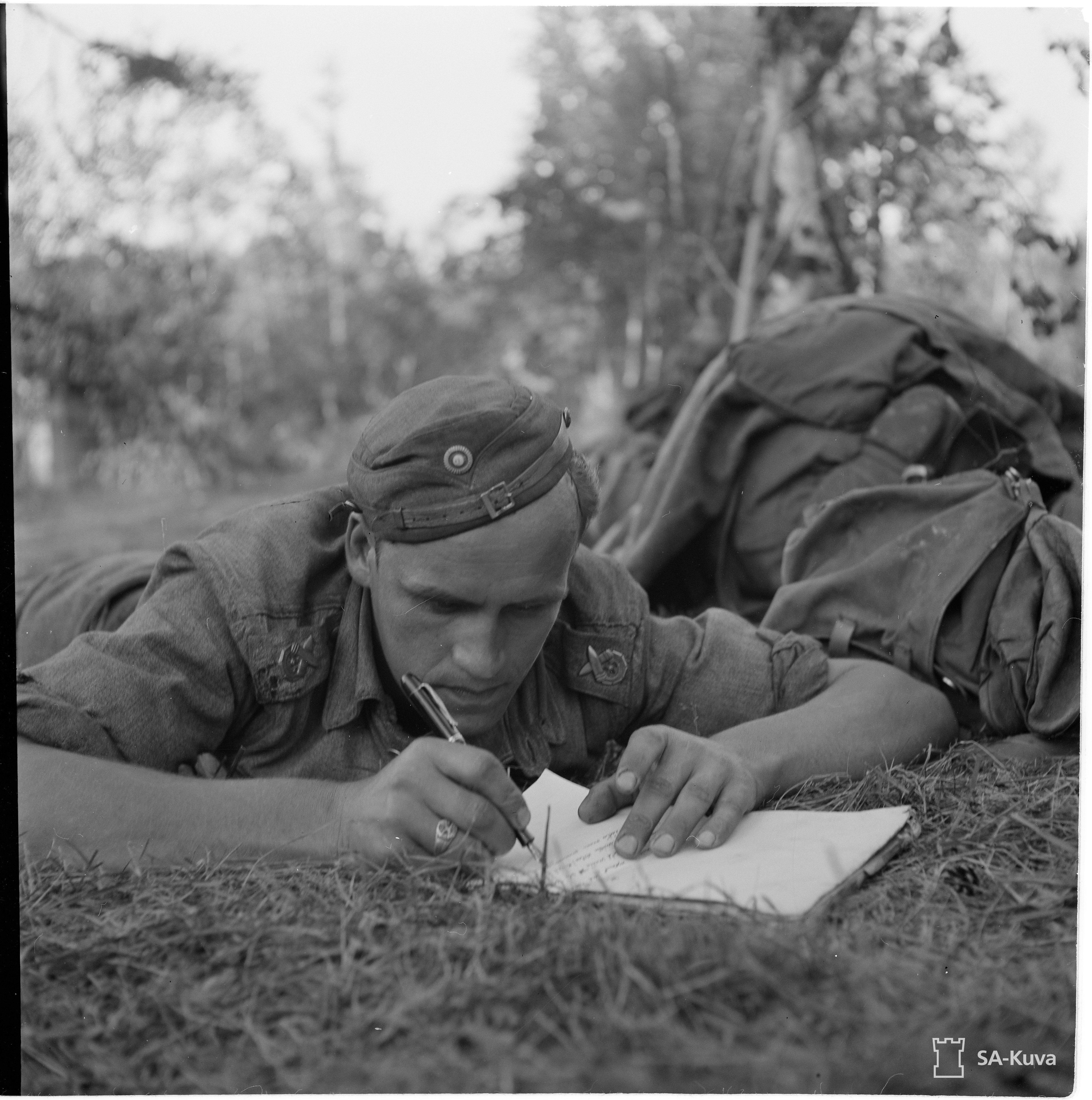 Finnish soldier writes a letter home, picture taken Kotkaselkä ...